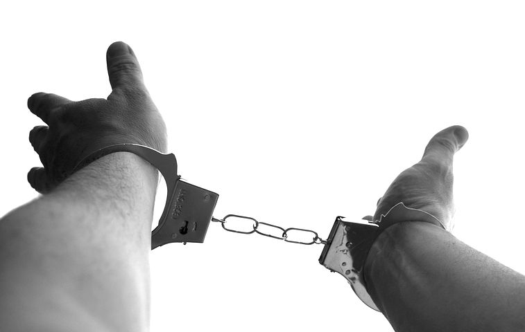 hand in handcuffs